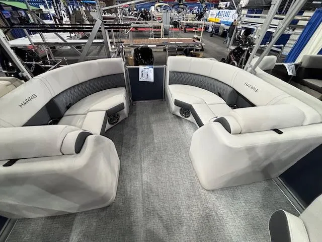 Slide: The Image of 2025 Harris Sunliner 230 CWDH pontoon boat interior with plush seating and modern design. - 16