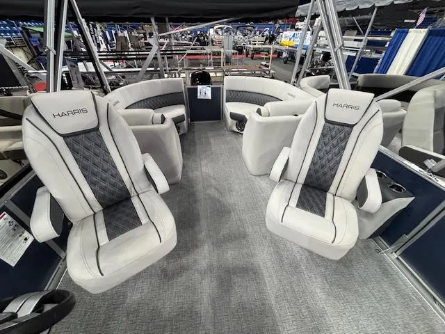 Slide: The Image of 2025 Harris Sunliner 230 CWDH pontoon boat interior with plush seating and modern design. - 17
