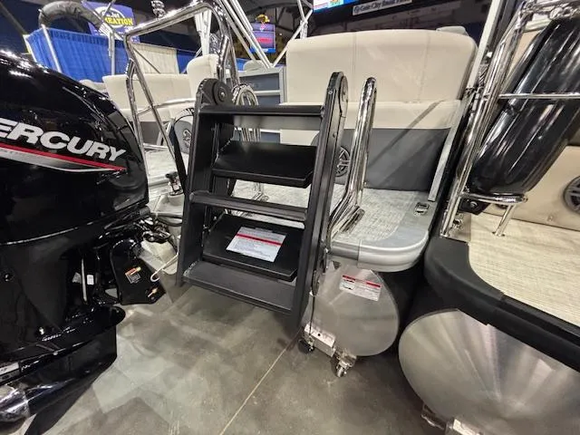 Slide: The Image of 2025 Harris Sunliner 230 CWDH boat with Mercury engine and boarding ladder. - 4