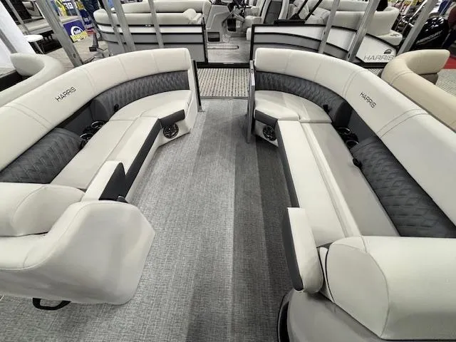 Slide: The Image of 2025 Harris Sunliner 230 CWDH interior with luxurious seating and modern design. - 5