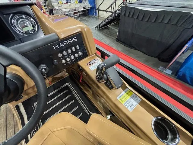 Slide: The Image of Interior view of 2025 Harris Solstice 230 boat dashboard and controls. - 16