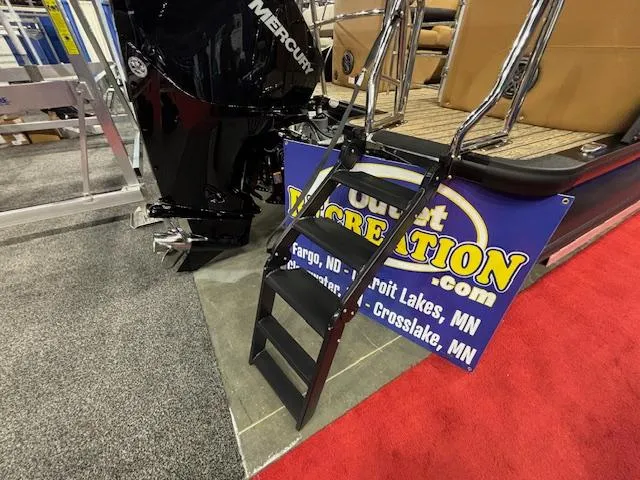 Slide: The Image of 2025 Harris Solstice 230 boat with Mercury engine and ladder at a recreation event. - 23