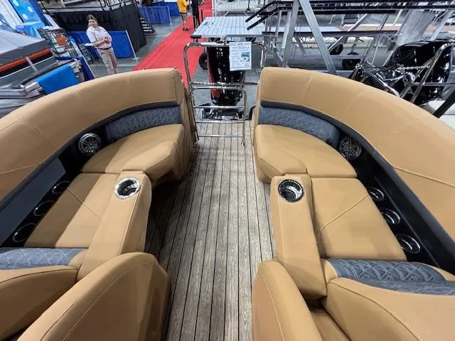 Slide: The Image of 2025 Harris Solstice 230 boat interior with tan seating and cup holders. - 9