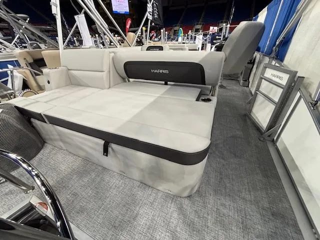 Slide: The Image of 2025 Harris Cruiser 210 SL boat interior with spacious seating and modern design. - 13