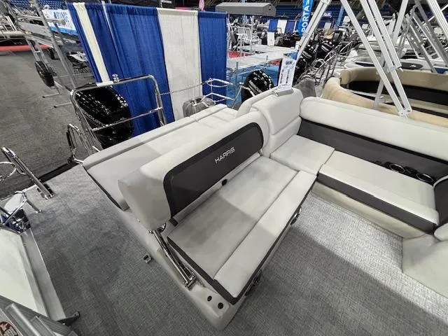 Slide: The Image of 2025 Harris Cruiser 210 SL boat interior with gray seating and modern design. - 19