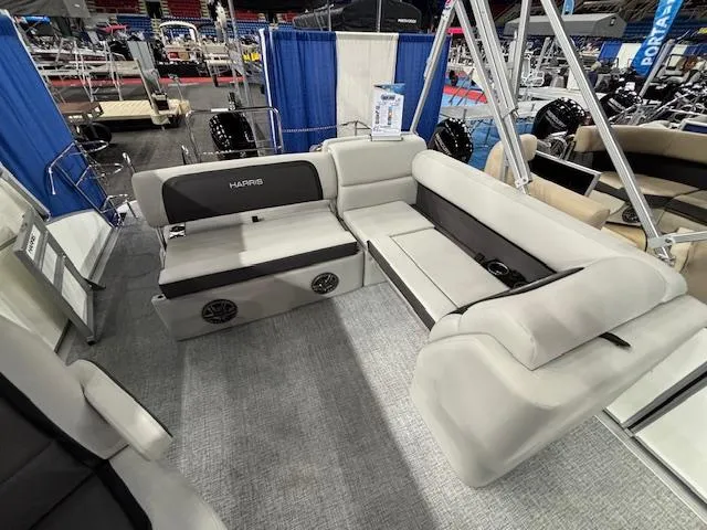 Slide: The Image of 2025 Harris Cruiser 210 SL pontoon boat interior with plush seating and modern design. - 20