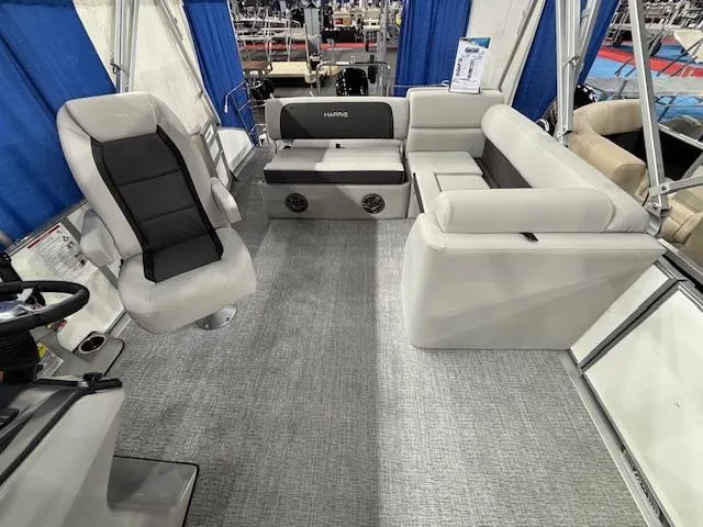 Slide: The Image of 2025 Harris Cruiser 210 SL interior with plush seating and modern design. - 21