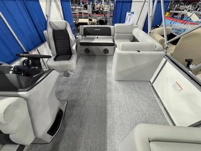 Slide: The Image of 2025 Harris Cruiser 210 SL interior with modern seating and steering console. - 22