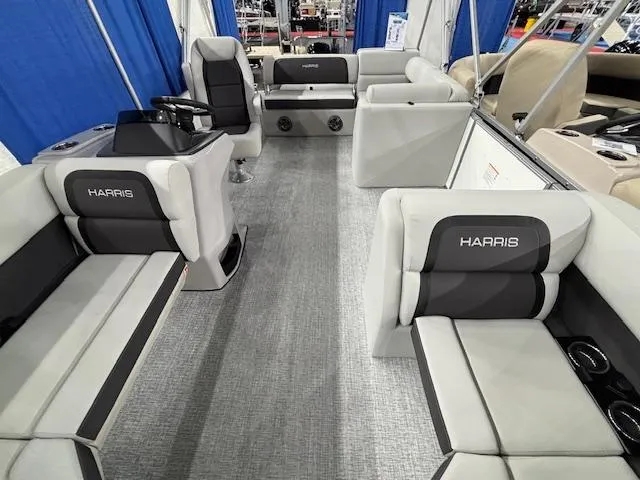 Slide: The Image of 2025 Harris Cruiser 210 SL interior with gray seating and modern design. - 23