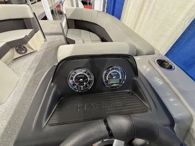 Slide: The Image of 2025 Harris Cruiser 210 SL dashboard with gauges and seating area. - 8