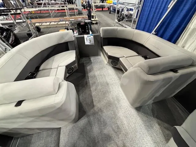 Slide: The Image of 2025 Harris Cruiser 230 interior with plush seating and modern design. - 11