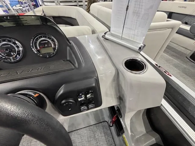 Slide: The Image of 2025 Harris Cruiser 230 dashboard with gauges and controls, featuring modern design and functionality. - 18