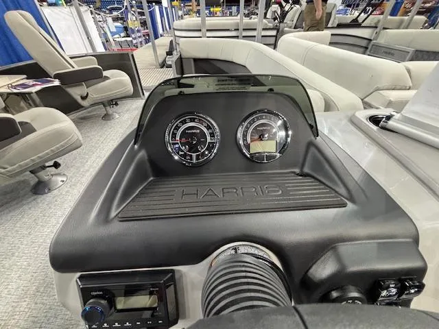 Slide: The Image of 2025 Harris Cruiser 230 dashboard with gauges and controls, featuring modern design and comfortable seating. - 19
