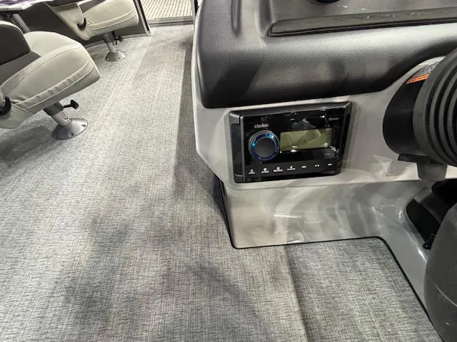 Slide: The Image of Interior of 2025 Harris Cruiser 230 boat with audio system and seating. - 20