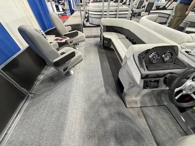 Slide: The Image of Interior of 2025 Harris Cruiser 230 pontoon boat with seating and dashboard. - 21