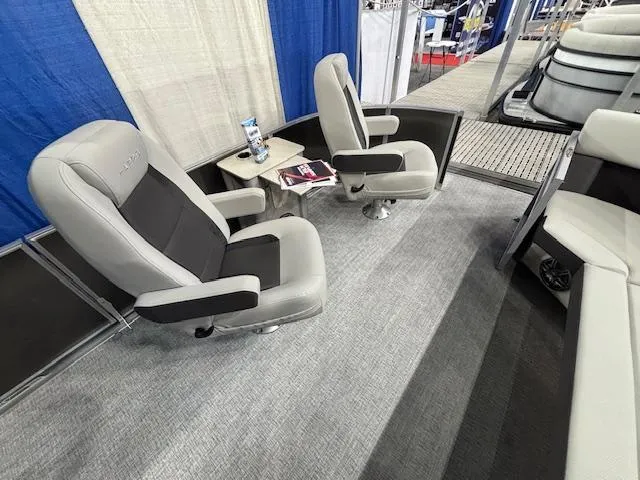 Slide: The Image of 2025 Harris Cruiser 230 interior with plush seating and modern design. - 22