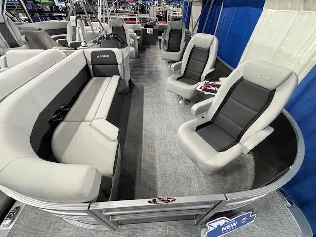Slide: The Image of 2025 Harris Cruiser 230 interior with gray seating and modern design. - 7