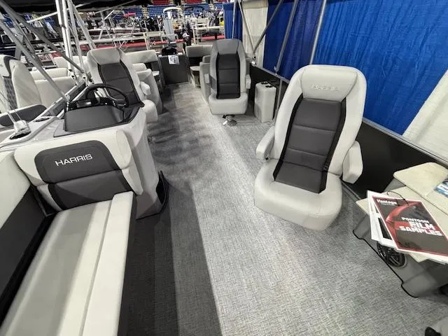 Slide: The Image of 2025 Harris Cruiser 230 interior with modern seating and sleek design. - 8