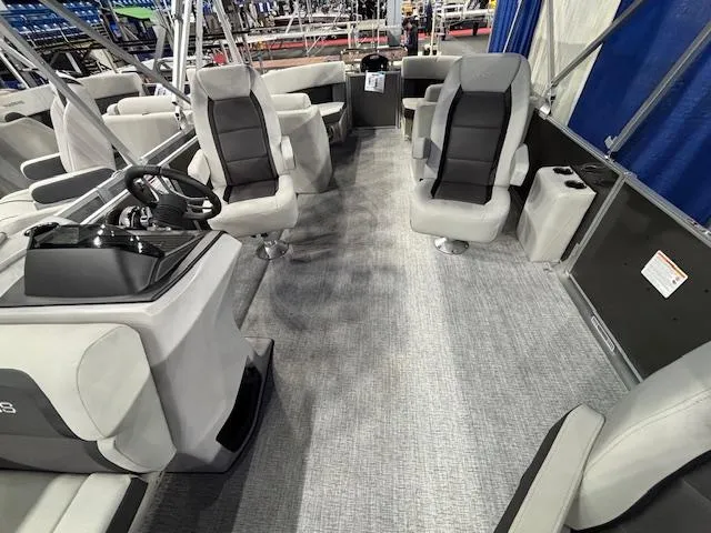 Slide: The Image of 2025 Harris Cruiser 230 interior with modern seating and steering console. - 9