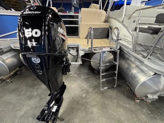 Slide: The Image of 2025 Harris Cruiser 190 pontoon boat with Mercury 60 HP outboard motor. - 13