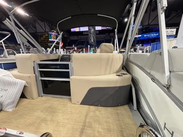 Slide: The Image of 2025 Harris Cruiser 190 boat interior with beige seating and modern design. - 14