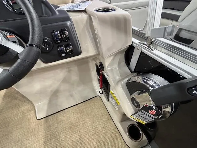 Slide: The Image of 2025 Harris Cruiser 190 boat dashboard with steering wheel and control panel. - 17