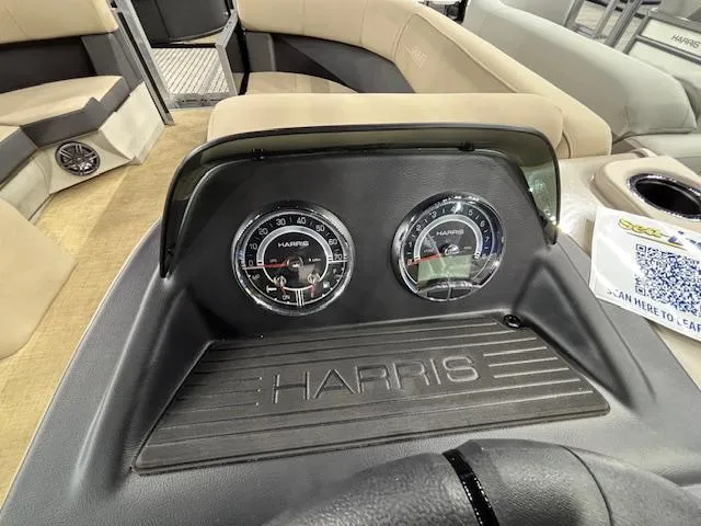 Slide: The Image of Dashboard of 2025 Harris Cruiser 190 boat with gauges and seating area. - 18