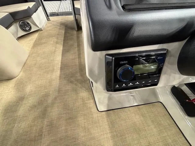 Slide: The Image of 2025 Harris Cruiser 190 interior with audio system and beige flooring. - 19