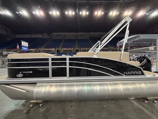 Slide: The Image of 2025 Harris Cruiser 190 pontoon boat displayed indoors, featuring sleek design and modern amenities. - 3