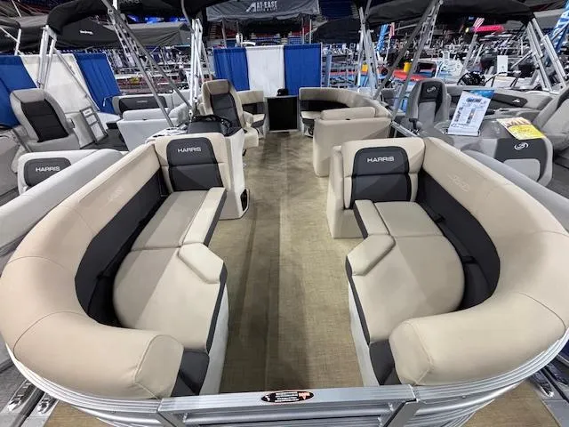 Slide: The Image of 2025 Harris Cruiser 190 pontoon boat with spacious seating and modern design. - 5