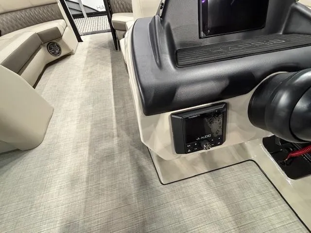 Slide: The Image of Interior of 2025 Harris SUNLINER 230 SLDH boat with modern dashboard and seating. - 10