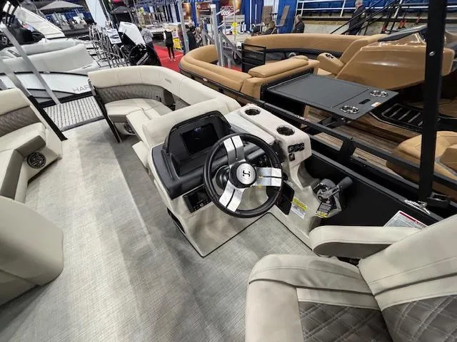 Slide: The Image of Interior view of 2025 Harris SUNLINER 230 SLDH pontoon boat with modern steering console. - 13