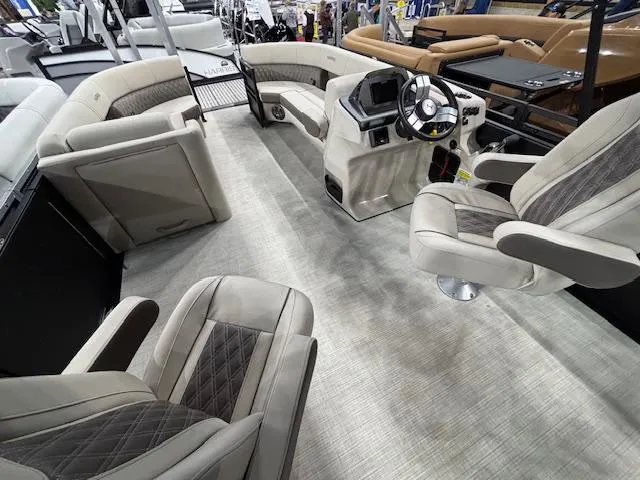 Slide: The Image of Interior of 2025 Harris SUNLINER 230 SLDH pontoon boat with luxurious seating and modern dashboard. - 14
