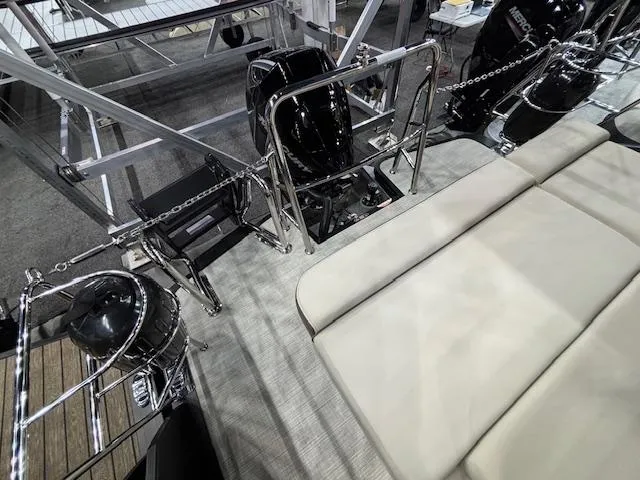 Slide: The Image of 2025 Harris SUNLINER 230 SLDH boat interior with seating and engine details. - 18