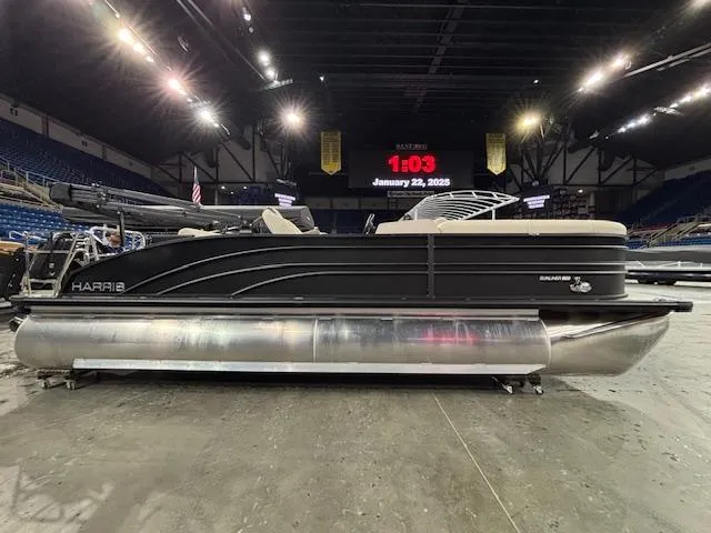 Slide: The Image of 2025 Harris SUNLINER 230 SLDH pontoon boat displayed indoors under bright lights. - 2