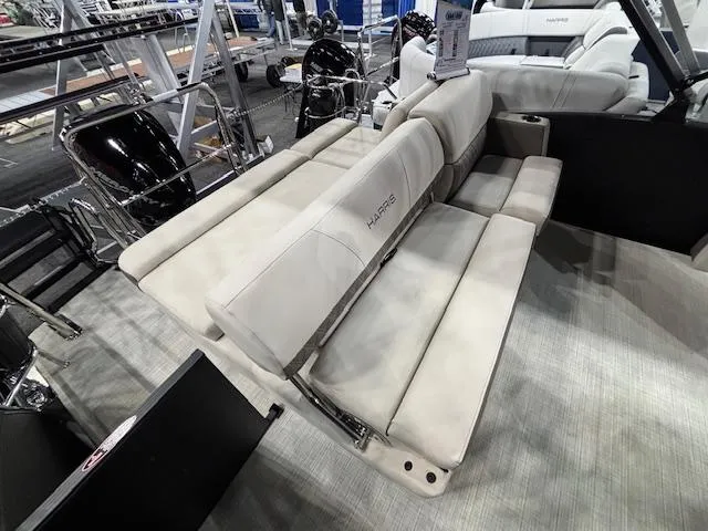 Slide: The Image of 2025 Harris SUNLINER 230 SLDH boat interior with luxurious seating and modern design. - 21