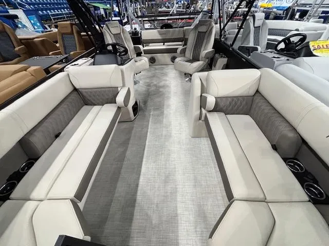 Slide: The Image of 2025 Harris SUNLINER 230 SLDH pontoon boat interior with luxurious seating and modern design. - 25