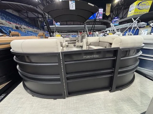 Slide: The Image of 2025 Harris SUNLINER 230 SLDH pontoon boat displayed indoors, featuring sleek design and comfortable seating. - 27