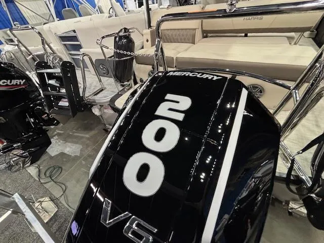 Slide: The Image of 2025 Harris SUNLINER 230 SLDH with Mercury 200 V6 engine at a boat show. - 5