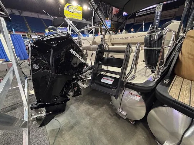 Slide: The Image of 2025 Harris SUNLINER 230 SLDH pontoon boat with Mercury engine at indoor exhibition. - 7
