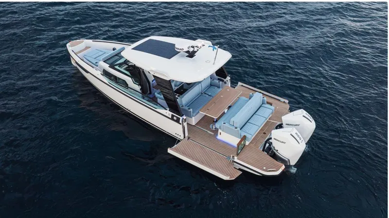 Slide: The Image of 2025 Saxdor 320 GTO luxury boat on open water, featuring sleek design and powerful engines. - 10
