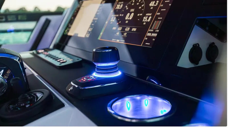 Slide: The Image of 2025 Saxdor 320 GTO dashboard with illuminated controls and digital display. - 15