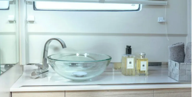 Slide: The Image of Modern bathroom sink in 2025 Saxdor 320 GTO yacht, featuring glass basin and luxury toiletries. - 18