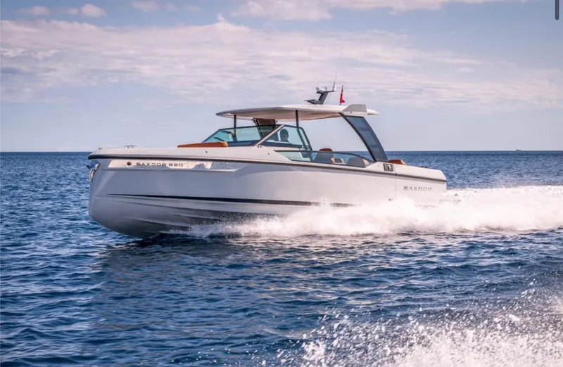 Slide: The Image of 2025 Saxdor 320 GTO cruising on open water under a clear sky. - 8