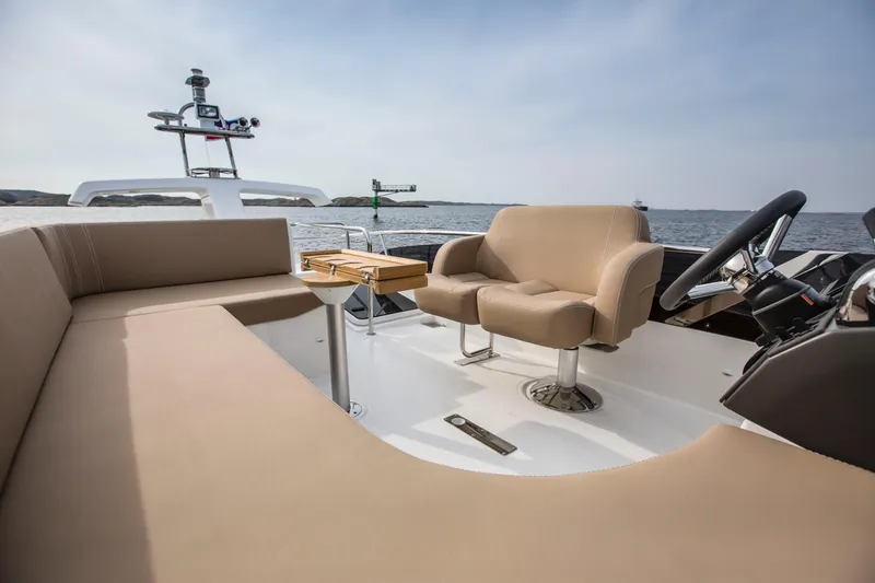 Slide: The Image of Luxurious seating on the 2025 Nimbus 405 Flybridge yacht, overlooking the ocean. - 5