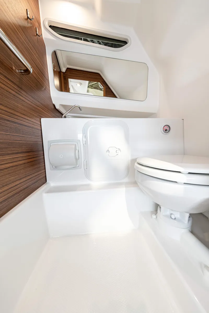 Slide: The Image of Modern bathroom interior of 2025 Nimbus Tender 8 boat, featuring sleek design and compact toilet. - 23