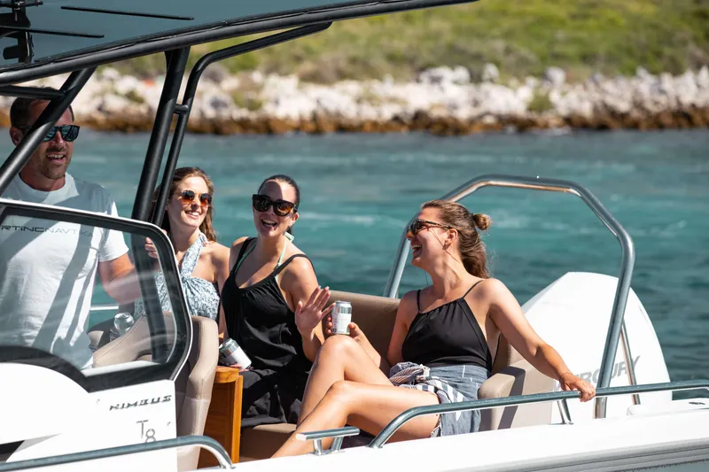 Slide: The Image of People enjoying a ride on a 2025 Nimbus Tender 8 boat. - 28