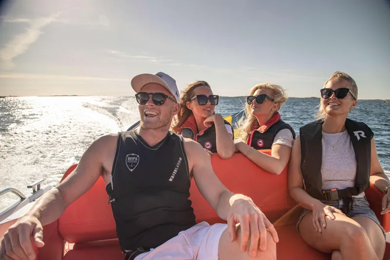 Slide: The Image of People enjoying a sunny boat ride on a 2025 Nimbus Tender 8. - 32