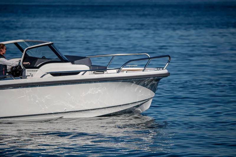 Slide: The Image of Nimbus Tender 8 boat cruising on calm blue waters, 2025 model. - 8