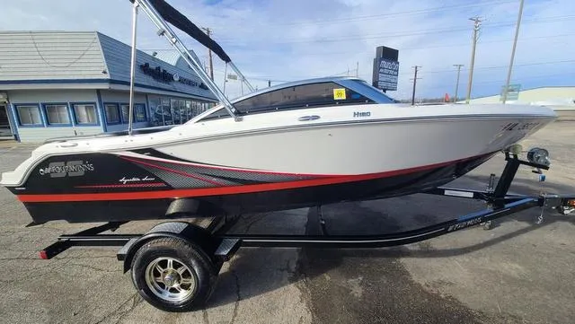 The Image of 2016 Four Winns H 180 SS boat on trailer, side view, outdoors. - 1